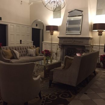 Ambassador Hotel Tulsa, Autograph Collection - The Ambassador has a cozy lobby with fireplace.  Perfect for a cold night! - Hotels Near Me - Tulsa, Oklahoma