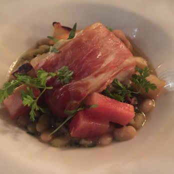 L'Oursin - Ling cod, wrapped in French prosciutto, served on a bed of flageolet beans (cooked with ham hock). Deconstructed fish cassoulet. Delicious! - French Near Me - Seattle, Washington L'Oursin - Ling cod, wrapped in French prosciutto, served on a bed of flageolet beans (cooked with ham hock). Deconstructed fish cassoulet. Delicious! - French Near Me - Seattle, Washington