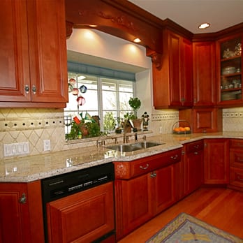 Lydon Construction - a kitchen with cherry wood cabinets - General Contractors Near Me Lydon Construction - a kitchen with cherry wood cabinets - General Contractors Near Me