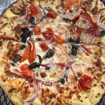 Pizza Biga - a pizza on a table - Pizza Near Me - Minneapolis, Minnesota Pizza Biga - a pizza on a table - Pizza Near Me - Minneapolis, Minnesota