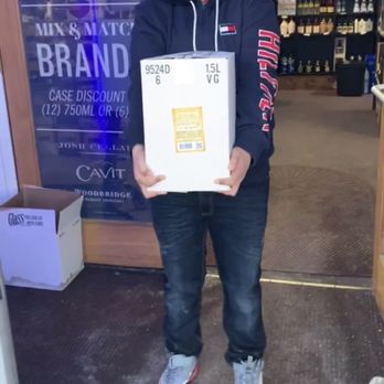 The Wine Sellar - a man holding a box of wine - Beer, Wine & Spirits Near Me - Watertown, New York The Wine Sellar - a man holding a box of wine - Beer, Wine & Spirits Near Me - Watertown, New York