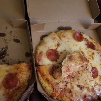Schlotzsky's - Pepperoni pizza with cheese layer pulled back to show lack of marinara sauce. - Delis Near Me - Moore, Oklahoma