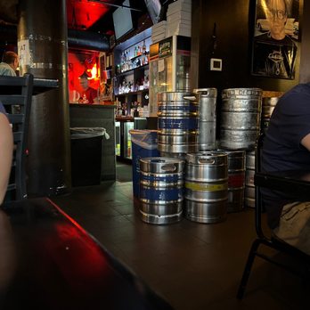 A Pizza Mart - a man sitting at a bar - Pizza Near Me - Seattle, Washington