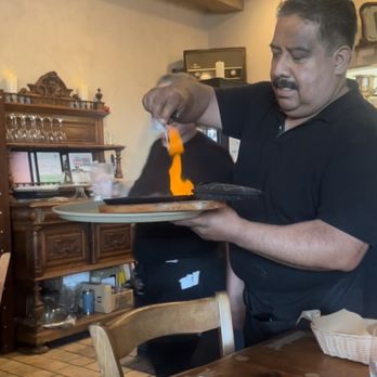 Olympic Cafe - Our awesome server and a flaming cheese app! - Mediterranean Near Me - San Diego, California Olympic Cafe - Our awesome server and a flaming cheese app! - Mediterranean Near Me - San Diego, California
