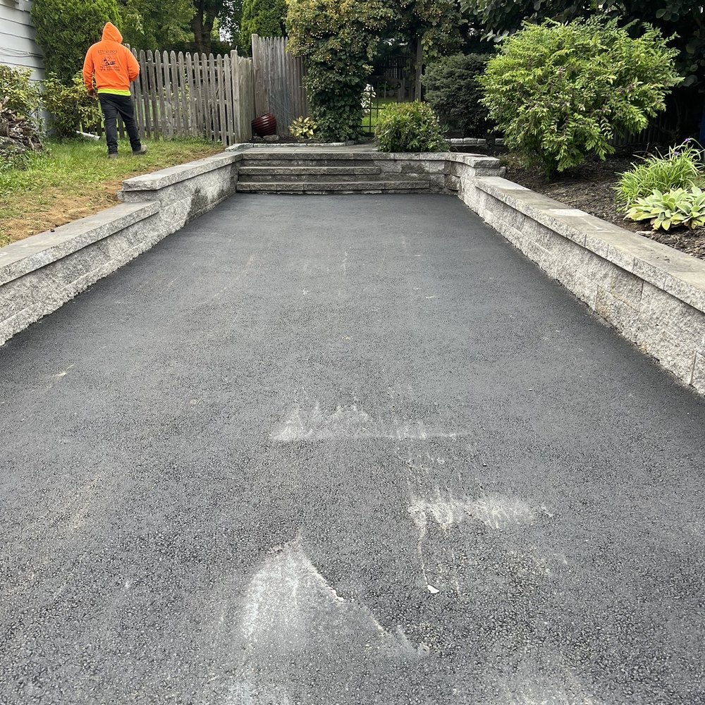 New paved driveway and new stone retaining walls
