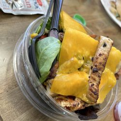 Angel’s Deli - Golden Salad: salad greens, grilled chicken, avocado, corn, cherry tomatoes and cheese. Can choose dressing flavor.