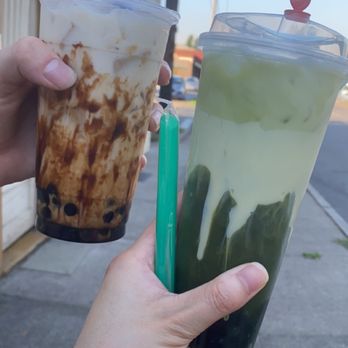 Wabi Sabi Tea - Tiger Sugar Milk Tea (Left) and Thai Green Milk Tea in reusable cup (Right) - Coffee & Tea Near Me - Salem, Oregon Wabi Sabi Tea - Tiger Sugar Milk Tea (Left) and Thai Green Milk Tea in reusable cup (Right) - Coffee & Tea Near Me - Salem, Oregon