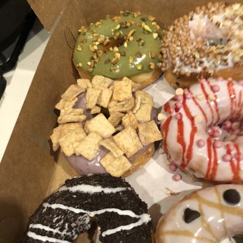 Glaze Doughnuts - half of my dozen of the fancy ones I believe it's green tea , blue berry, cookies and cream , salted caramel and I can't remember the other - Donuts Near Me - Las Vegas, Nevada Glaze Doughnuts - half of my dozen of the fancy ones I believe it's green tea , blue berry, cookies and cream , salted caramel and I can't remember the other - Donuts Near Me - Las Vegas, Nevada