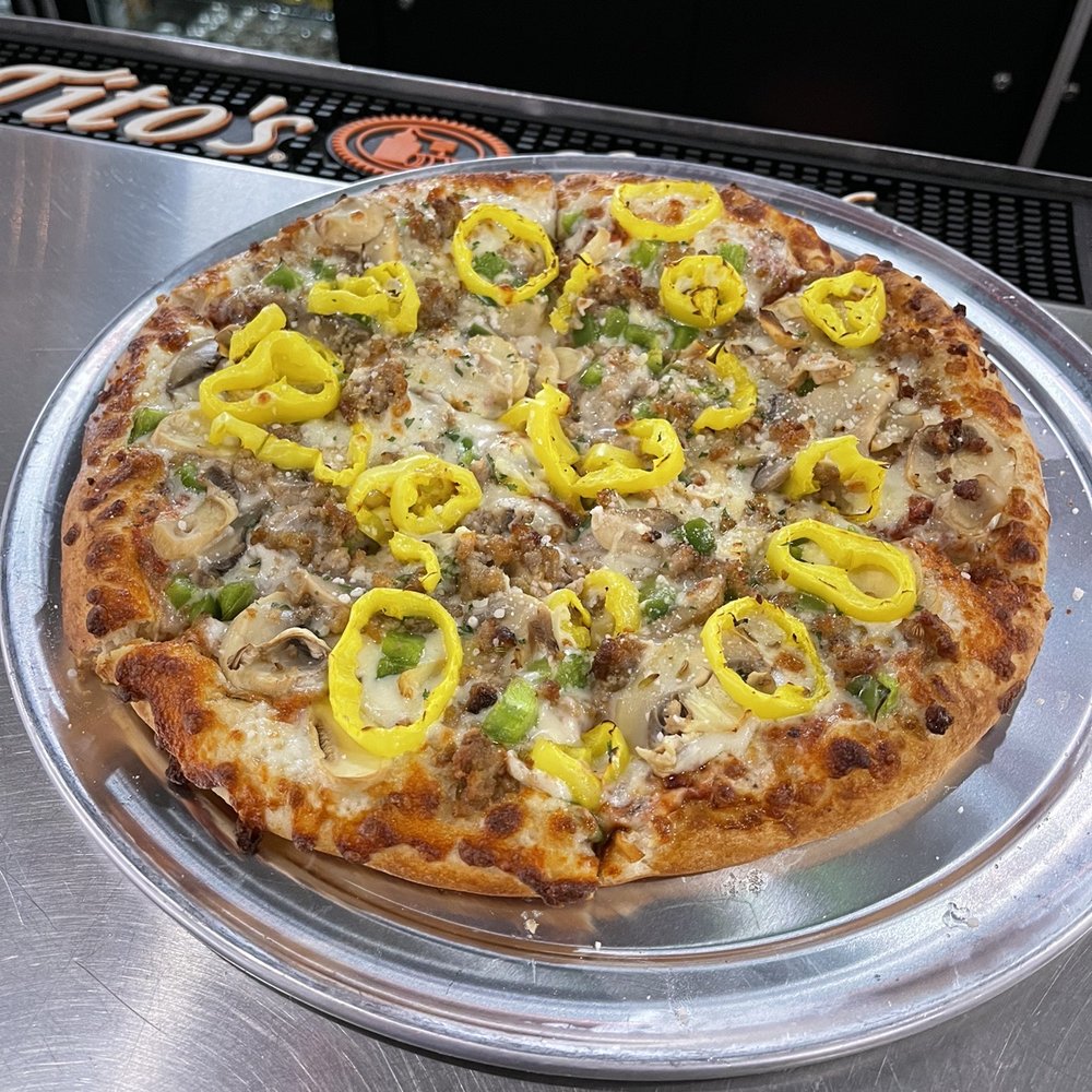 a pizza with yellow peppers
