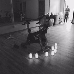 Spin Classes - room is darkened and candles lit to see the instructor.