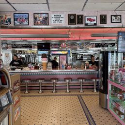 Classic diner with barstools "reserved" for the greats like Marilyn, Elvis, James Dean, Elizabeth Taylor, Frank Sinatra and more.
