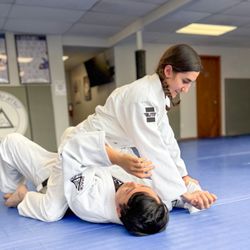 Gracie Martial Arts & Self Defense Tampa - Eyahli practices an americana armlock setup