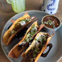 Paloma - The Slow Roasted Brisket Birio Tacos were super flavorful. They are accompanied by a delicious homemade dipping sauce.