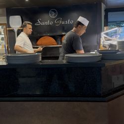 Ristorante Francesco - WHILE A PIZZA BAKES IN THE OVEN, THE CHEF PREPARES ANOTHER GOURMET PLATE.