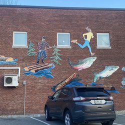 Alamo Theatre - Plenty of parking in the lot next to the theater. Also some fun "Mainer" artwork on the brick building.