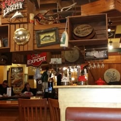 Swiss Chalet Rotisserie & Grill - "Homey" bar , nicely decorated.