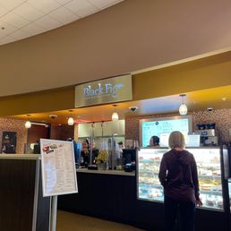 a woman standing in front of the counter a woman standing in front of the counter