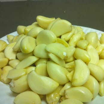 Midtown Pizza - a pile of peeled garlic on a paper plate - Pizza Near Me - Middletown, Pennsylvania