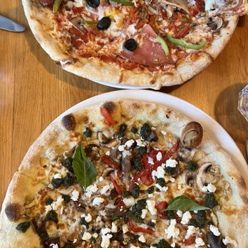 Alberello Pizzeria - two pizzas on a table - Italian Near Me - North Vancouver, British Columbia Alberello Pizzeria - two pizzas on a table - Italian Near Me - North Vancouver, British Columbia