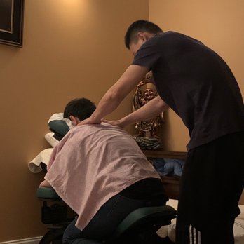 Total Health Spa - My son getting a 15 minute chair massage for the first time. He's addicted! - Massage Near Me - Buford, Georgia