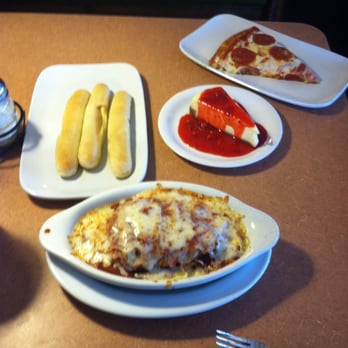 Fazoli's - Combo #7: Chicken Parmesan with a side of pizza and unlimited breadsticks (drink included, but not pictured). NY Cheesecake too. - Italian Near Me - Fayetteville, North Carolina