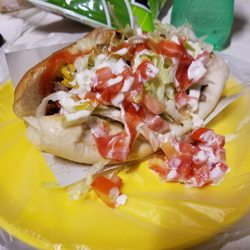 Los Pichus - Hot dog wrapped in bacon topped with carne asada with all the fixins