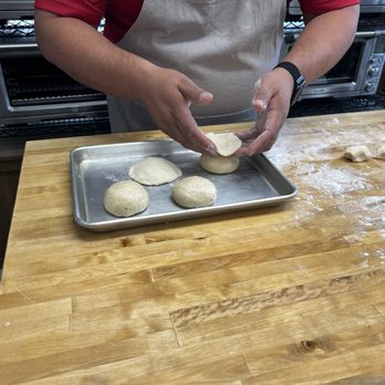 Baking Evolution School of Baking - Chef Alex showing us the topping technique - Cooking Schools Near Me - Duarte, California Baking Evolution School of Baking - Chef Alex showing us the topping technique - Cooking Schools Near Me - Duarte, California