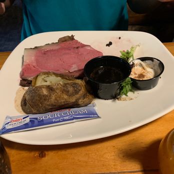 Powder House Restaurant - The Prime Rib (12 oz)  ordered medium rare- about 1/3 gone by the time I snapped this photo. - Steakhouses Near Me - Keystone, South Dakota