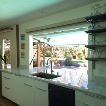 Finesse Builder - a kitchen with a sink and a window - General Contractors Near Me