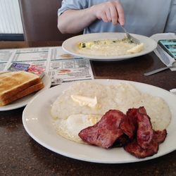 Turkey bacon, eggs over easy, and grits