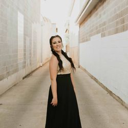 Gown Town - Black and gold is a classic combination that looks amazing in this dress.