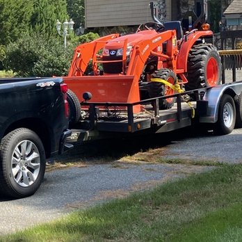 Jcf Lawn Care - a tractor on the back of a truck - Lawn Services Near Me - Waterford, Connecticut Jcf Lawn Care - a tractor on the back of a truck - Lawn Services Near Me - Waterford, Connecticut