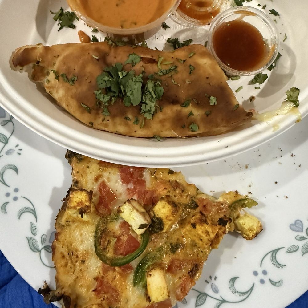 Not the best pic- Paneer Tikka pizza slice and naan wrap! Not the best pic- Paneer Tikka pizza slice and naan wrap!
