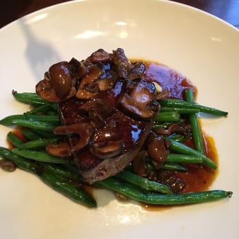 Fork - Petite filet mignon with a bourbon-porchini-peppercorn sauce served over green beans with pistachios. - New American Near Me - Boise, Idaho Fork - Petite filet mignon with a bourbon-porchini-peppercorn sauce served over green beans with pistachios. - New American Near Me - Boise, Idaho