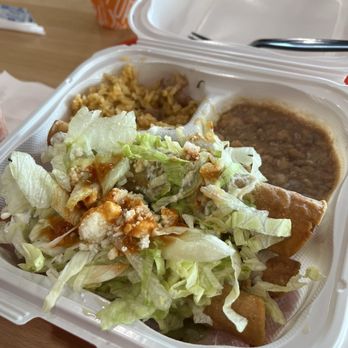 Roll Em Up Taquitos - Combination plate of three taquitos with beans and rice. Yum !! - Mexican Near Me - Fresno, California