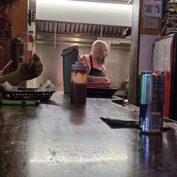 Steve's Bar & Grill - This is the clothing that the cook is wearing no beard cover.No, gloves and lots of armpit hair