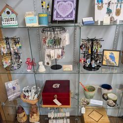 Various pieces that range from jewelry, wooden boxes, Pottery,art work,