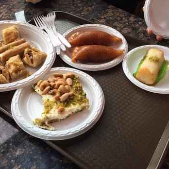 Shatila Bakery - Dearborn - Aish El-Saraya bottom left and Qatayef top middle - Desserts Near Me - Dearborn, Michigan Shatila Bakery - Dearborn - Aish El-Saraya bottom left and Qatayef top middle - Desserts Near Me - Dearborn, Michigan