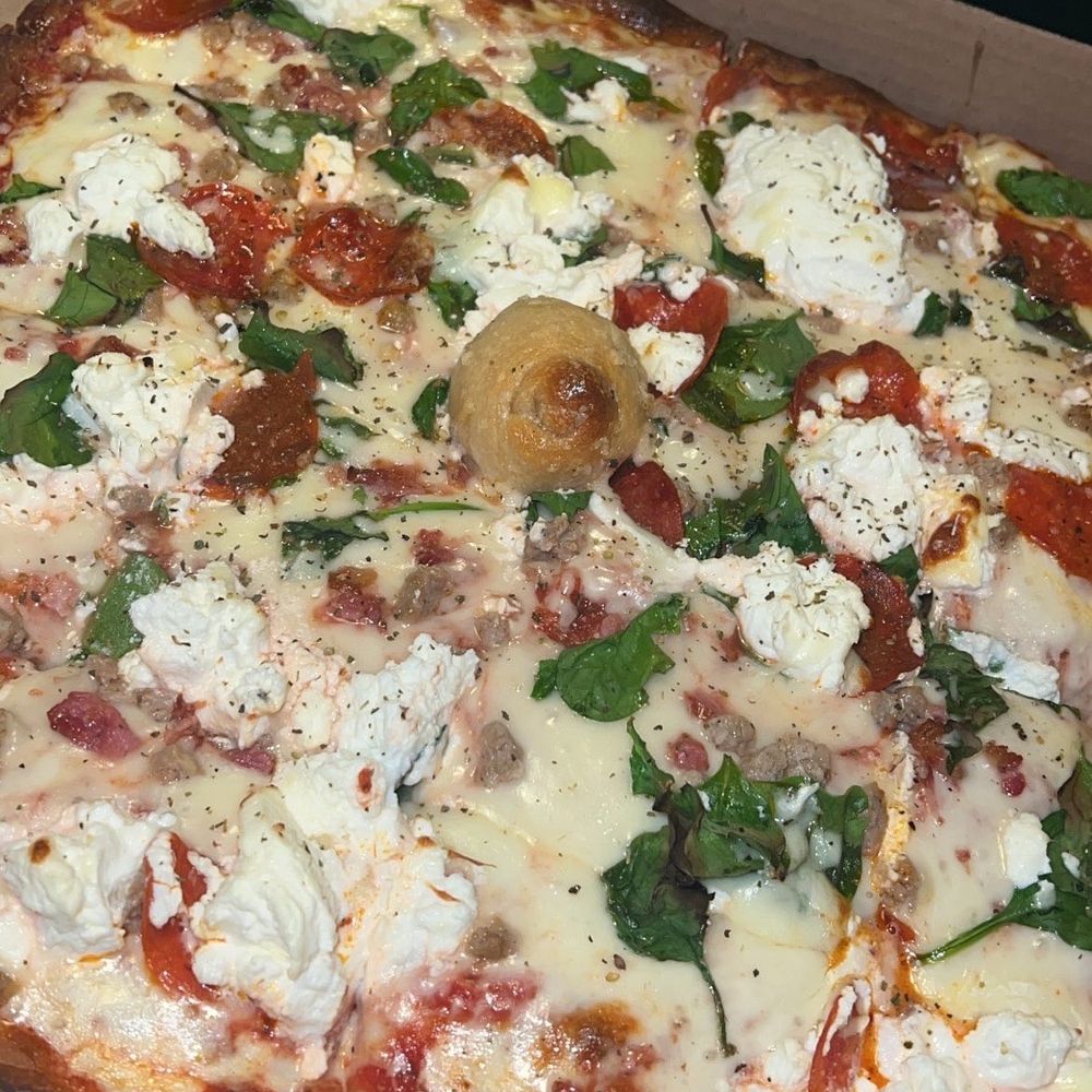 Meat lovers pizza with spinach and ricotta Meat lovers pizza with spinach and ricotta
