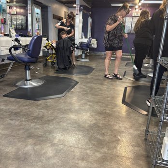 Supercuts - The receptionist sweeping as the hair is falling from cuts. The business is very clean. - Hair Salons Near Me - YUBA CITY, California Supercuts - The receptionist sweeping as the hair is falling from cuts. The business is very clean. - Hair Salons Near Me - YUBA CITY, California