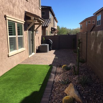 Envirogreen Landscape Design - Build - Turf, boulders, barrel cacti, San Pedro cactus, lighting, the works. A lot going on but not busy. Perfect balance. - Landscape Architects or Designers Near Me - Scottsdale, Arizona