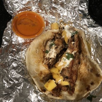 Torchy's Tacos - Brushfire taco (to-go) with sauce. - Tacos Near Me - San Antonio, Texas Torchy's Tacos - Brushfire taco (to-go) with sauce. - Tacos Near Me - San Antonio, Texas