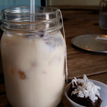 ChadLou's Coffee Roasters - Coconut mac nut iced tea latte with a lavender coconut truffle - Coffee & Tea Near Me - Kailua, Hawaii ChadLou's Coffee Roasters - Coconut mac nut iced tea latte with a lavender coconut truffle - Coffee & Tea Near Me - Kailua, Hawaii