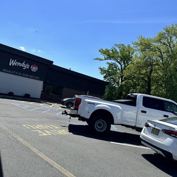 Wendy's - a white pickup truck parked in a parking lot - Burgers Near Me - Clark, New Jersey