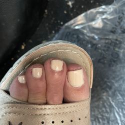 Lv Nails - Polish on cuticles.  Nails not dry so smudged.