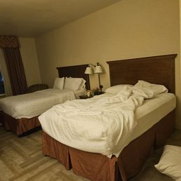 View of unmade bed in the room I was checked into View of unmade bed in the room I was checked into