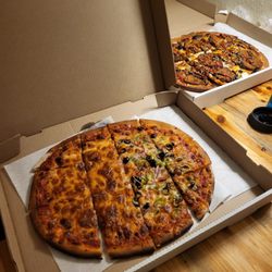 The Brick Oven Bistro - Left box: Cheese/veggie build your own and Right box: Nonna eggplant specialty pizza