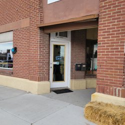 The Corner Cup - Front Entry
(Image shows red brick building with big windows and white framed glass door. )