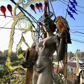 Randyland - Statue with some colored glass in the background - Public Art Near Me - Los Angeles, California Randyland - Statue with some colored glass in the background - Public Art Near Me - Los Angeles, California