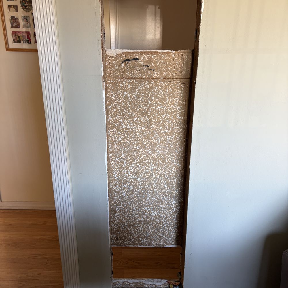 California Quality Drywall Services - hole after gas heater removed - Drywall Installation & Repair Near Me